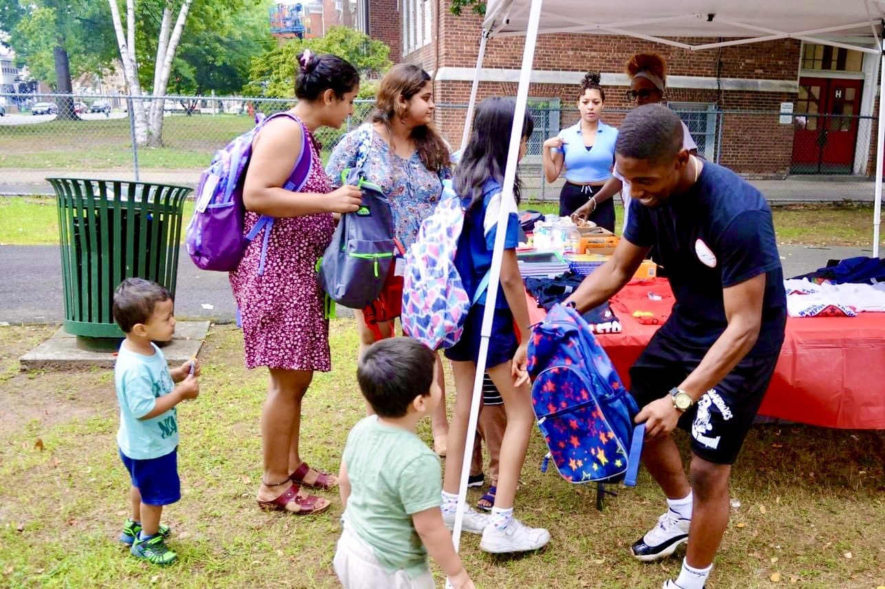 Handing out supplies at a community drive